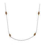 This delicate white gold chain is complemented by .06 ctw of white diamond accents.