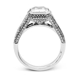 This 18k white and rose gold ring has a clean, graduated design with .84 ctw of baguette diamonds leading up to the center stone. The edges are bordered by .49 ctw of pink diamonds set into rose gold.