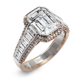 This 18k white and rose gold ring has a clean, graduated design with .84 ctw of baguette diamonds leading up to the center stone. The edges are bordered by .49 ctw of pink diamonds set into rose gold.