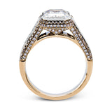 This 18k white and rose gold ring has a clean, graduated design with .84 ctw of baguette diamonds leading up to the center stone. The edges are bordered by .49 ctw of pink diamonds set into rose gold.