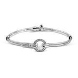 This wonderful 18k gold bracelet would be perfect for everyday wear with .39 ctw of white diamonds set into a circular buckle design.