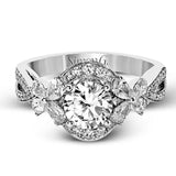 Dramatic yet romantic, this exquisite white gold engagement ring features .30 ctw of round cut white diamonds highlighted by .54 ctw of pear shaped diamonds in delicate floral motifs.