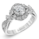 Dramatic yet romantic, this exquisite white gold engagement ring features .30 ctw of round cut white diamonds highlighted by .54 ctw of pear shaped diamonds in delicate floral motifs.