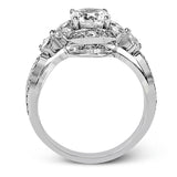 Dramatic yet romantic, this exquisite white gold engagement ring features .30 ctw of round cut white diamonds highlighted by .54 ctw of pear shaped diamonds in delicate floral motifs.