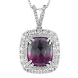 This lovely pendant features a rectangular opaque 9.40 ct paraiba tourmaline center stone, surrounded by a double halo- the inner halo has .43 ctw of white diamonds, and the outer halo contains 1.85 ctw of blue sapphires.