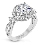 Dramatic yet romantic, this exquisite white gold engagement ring features .61 ctw of round cut white diamonds highlighted by .58 ctw of pear shaped diamonds in delicate floral motifs.