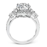 Dramatic yet romantic, this exquisite white gold engagement ring features .61 ctw of round cut white diamonds highlighted by .58 ctw of pear shaped diamonds in delicate floral motifs.