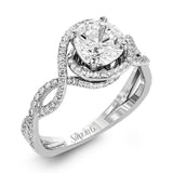 Classic with a modern twist, this white gold engagement ring features .50 ctw of sparkling white diamonds in a dramatic openwork design.