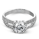 The charming design of this white gold contemporary ring is accented by .36 ctw baguette cut diamonds and .33 ctw round cut white diamonds.