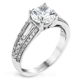 The charming design of this white gold contemporary ring is accented by .36 ctw baguette cut diamonds and .33 ctw round cut white diamonds.