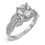 Presenting a dramatic contemporary design, this two-tone engagement ring is highlighted with .42 ctw of sparkling white diamonds.