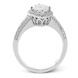 This remarkable 18k white gold ring contains a 1.28 ctw two-piece mosaic center which creates the look of a pear shaped diamond. This centerpiece is accented .48 ctw of white round brilliant diamonds.