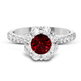 This splendid white gold ring features a 1.53 ctw round ruby highlighted by 1.00 ctw of round white diamonds adorning the halo and shank.