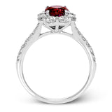 This splendid white gold ring features a 1.53 ctw round ruby highlighted by 1.00 ctw of round white diamonds adorning the halo and shank.
