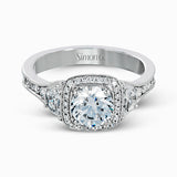 Featuring a lovely contemporary design, this white gold ring is complemented by a halo of .28 ctw round cut white diamonds and accented with .44 ctw moon shaped diamonds.