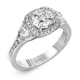 Featuring a lovely contemporary design, this white gold ring is complemented by a halo of .28 ctw round cut white diamonds and accented with .44 ctw moon shaped diamonds.
