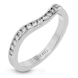 Featuring a lovely contemporary design, this white gold ring is complemented by a halo of .28 ctw round cut white diamonds and accented with .44 ctw moon shaped diamonds.
