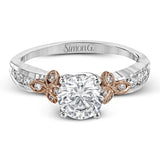 This delicate white gold ring features lovely rose gold accents on the shank and is set with .24 ctw of round cut white diamond accents.