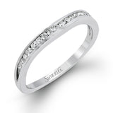 This delicate white gold ring features lovely rose gold accents on the shank and is set with .24 ctw of round cut white diamond accents.