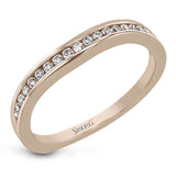 This delicate white gold ring features lovely rose gold accents on the shank and is set with .24 ctw of round cut white diamond accents.