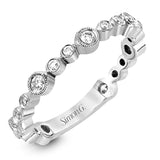 This wonderful stacking band can be worn with others or on its own. It has .30 ctw of multi-sized round white diamonds.