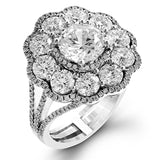 The dramatic floral cluster design of this white and rose gold vintage-inspired ring is set with 2.45 ctw round cut white diamonds and .21 ctw pink diamonds.