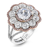 The dramatic floral cluster design of this white and rose gold vintage-inspired ring is set with 2.45 ctw round cut white diamonds and .21 ctw pink diamonds.