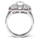 The dramatic floral cluster design of this white and rose gold vintage-inspired ring is set with 2.45 ctw round cut white diamonds and .21 ctw pink diamonds.