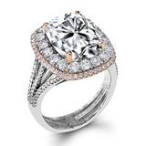 This incredible 18k white and rose gold ring makes a statement with 1.26 ctw of white diamonds encircling a wonderful 6.68 ct kunzite center stone.