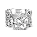 Featuring a romantic vintage-inspired design, this intricate, swirling white gold ring is accentuated by .35 ctw glistening round cut white diamonds.