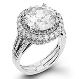 This 18k white and rose gold engagement ring is sure to turn heads with 1.09 ctw of white diamonds as well as .12 ctw of pink diamonds.