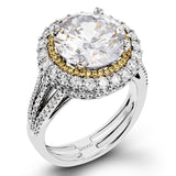 This 18k white and rose gold engagement ring is sure to turn heads with 1.09 ctw of white diamonds as well as .12 ctw of pink diamonds.