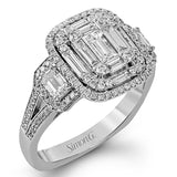This dramatic contemporary white and rose gold ring is highlighted by a sparkling halo set with .11 ctw pink diamonds and accented with .35 ctw round cut white diamonds, .38 ctw emerald cut diamonds, and .65 ctw baguette cut diamonds.