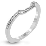 This dramatic contemporary white and rose gold ring is highlighted by a sparkling halo set with .11 ctw pink diamonds and accented with .35 ctw round cut white diamonds, .38 ctw emerald cut diamonds, and .65 ctw baguette cut diamonds.