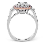 This dramatic contemporary white and rose gold ring is highlighted by a sparkling halo set with .11 ctw pink diamonds and accented with .35 ctw round cut white diamonds, .38 ctw emerald cut diamonds, and .65 ctw baguette cut diamonds.