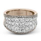 This bold statement ring is made from 18k rose and white gold and contains 2.01 ctw of white round brilliant diamonds as well as .23 ctw of pink diamonds.