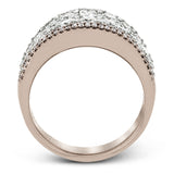 This bold statement ring is made from 18k rose and white gold and contains 2.01 ctw of white round brilliant diamonds as well as .23 ctw of pink diamonds.