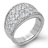 This bold statement ring is made from 18k rose and white gold and contains 2.01 ctw of white round brilliant diamonds as well as .23 ctw of pink diamonds.