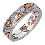 Featuring a distinctive paisley design, this modern white and rose gold band is accentuated by .30 ctw round cut white diamonds.