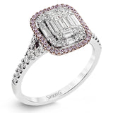 The modern style of this white gold ring is complemented by .48 ctw of glistening baguette cut white diamonds and .38 ctw of round cut white diamonds.