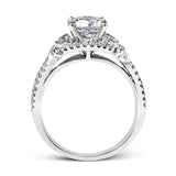 Featuring a delicately twisted shank, this brilliant white gold engagement ring and complimentary wedding band are set with .55 ctw of round cut white diamonds.