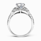 Featuring a delicately twisted shank, this brilliant white gold engagement ring and complimentary wedding band are set with .55 ctw of round cut white diamonds.