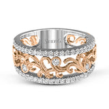 This vintage-inspired 18k white gold band features a detailed, floral design bordered by .52 ctw of white round brilliant diamonds.