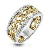 This vintage-inspired 18k white gold band features a detailed, floral design bordered by .52 ctw of white round brilliant diamonds.
