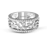 This vintage-inspired 18k white gold band features a detailed, floral design bordered by .52 ctw of white round brilliant diamonds.