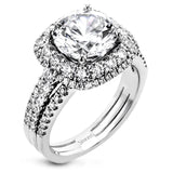 Featuring a brilliant halo setting, this contemporary white gold ring is set with 1.35 ctw glistening round cut white diamonds.
