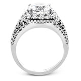 Featuring a brilliant halo setting, this contemporary white gold ring is set with 1.35 ctw glistening round cut white diamonds.