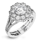 This lovely modern white gold ring features an eye-catching cluster halo set with .97 ctw shimmering round cut white diamonds.
