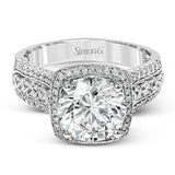 This eye-catching modern white gold ring is accentuated by an elegant halo highlighted with .64 ctw of round cut white diamonds.