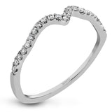 Featuring delicate floral designs on the shank, this modern white gold ring is complemented by .19 ctw of round cut white diamonds and .02 ctw pink diamond accents.